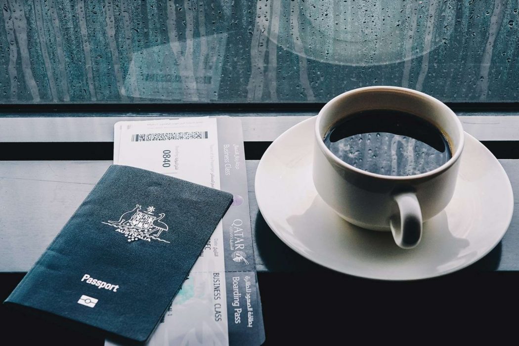 Cup of coffee, passport and boarding pass as seen in Sydney NSW, Australia – Issues in the Travel Industry That Frequent Flyers Might Notice