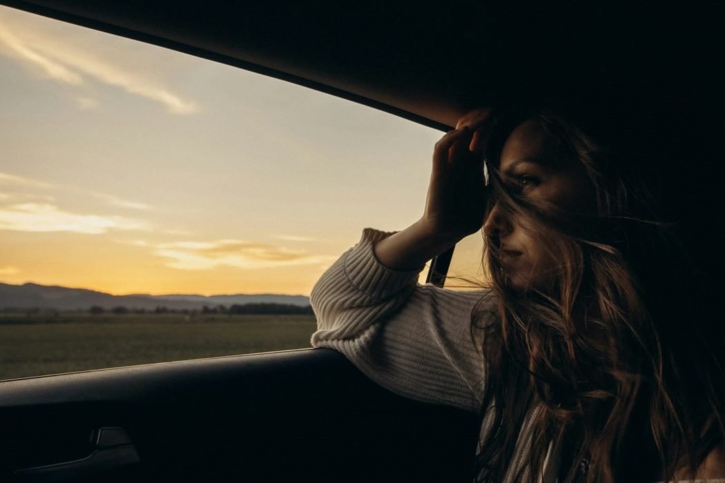 Woman sitting in a car – Sauvie Island Farms, Portland, United States – Drug free migraine relief on the go
